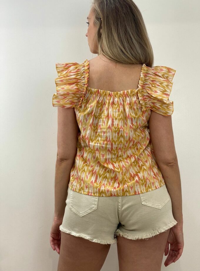 Blusa con volante naranja