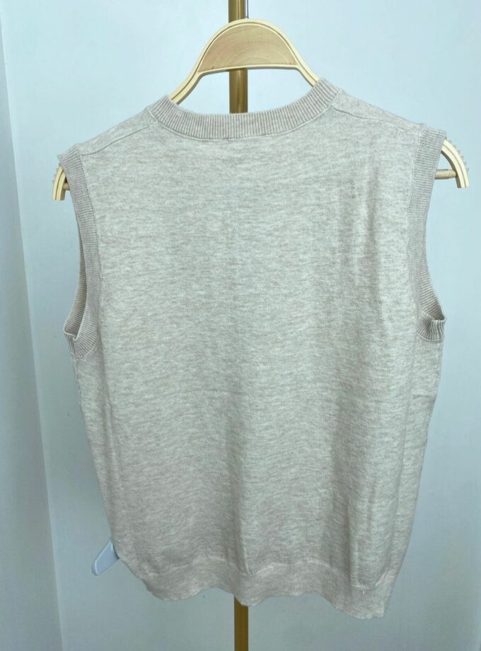 Chaleco sin manga con botón